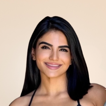 Headshot portrait of a Figue Madera Pilates instructor against a light background.